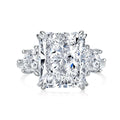 Radiant cut 3 stone ring in sterling silver with a large rectangular center stone and round side stones