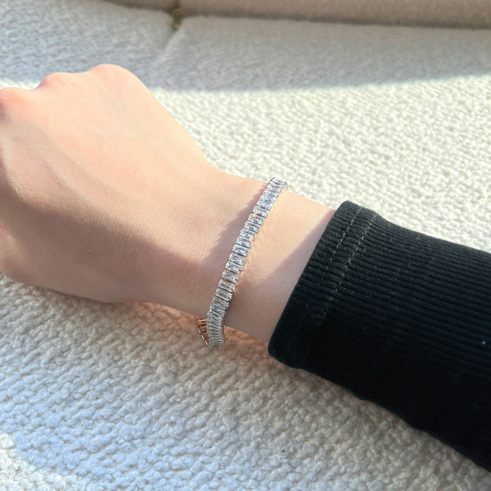 woman wearing silver emerald-cut cubic zirconia bracelet