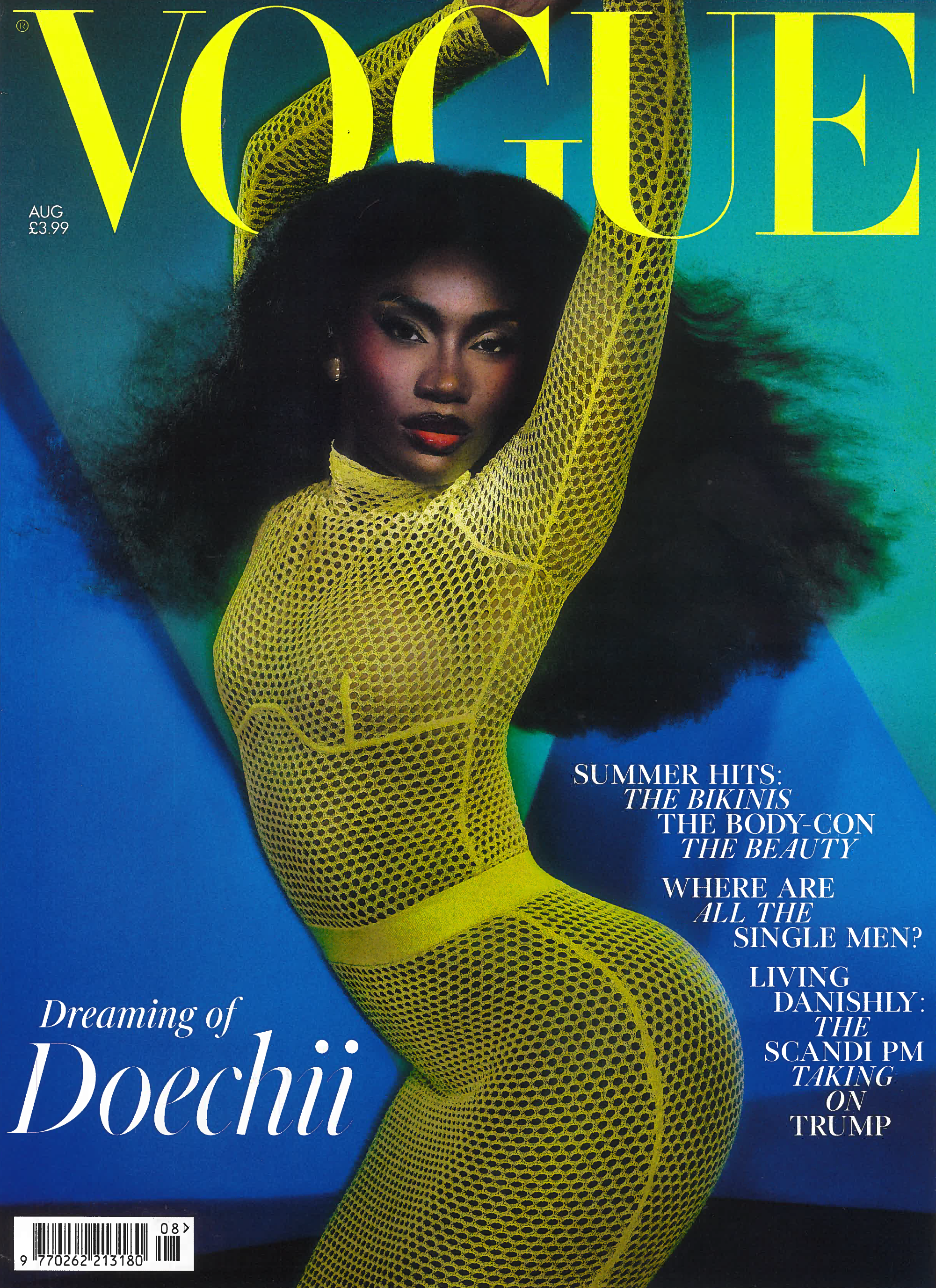 Vogue magazine cover featuring a model in a yellow fishnet outfit against a blue and green background.