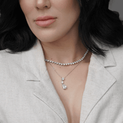 woman wearing heart, oval, and pear-shaped cubic zirconia necklace