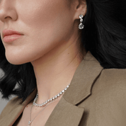 woman wearing heart, oval, and pear-shaped cubic zirconia earrings