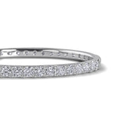 solid silver bangle with round brilliant moissanite stones all around by Viviana Halil

