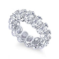 Shared prong oval-cut wedding band in sterling silver with a full-circle of diamond alternative VH zirconia