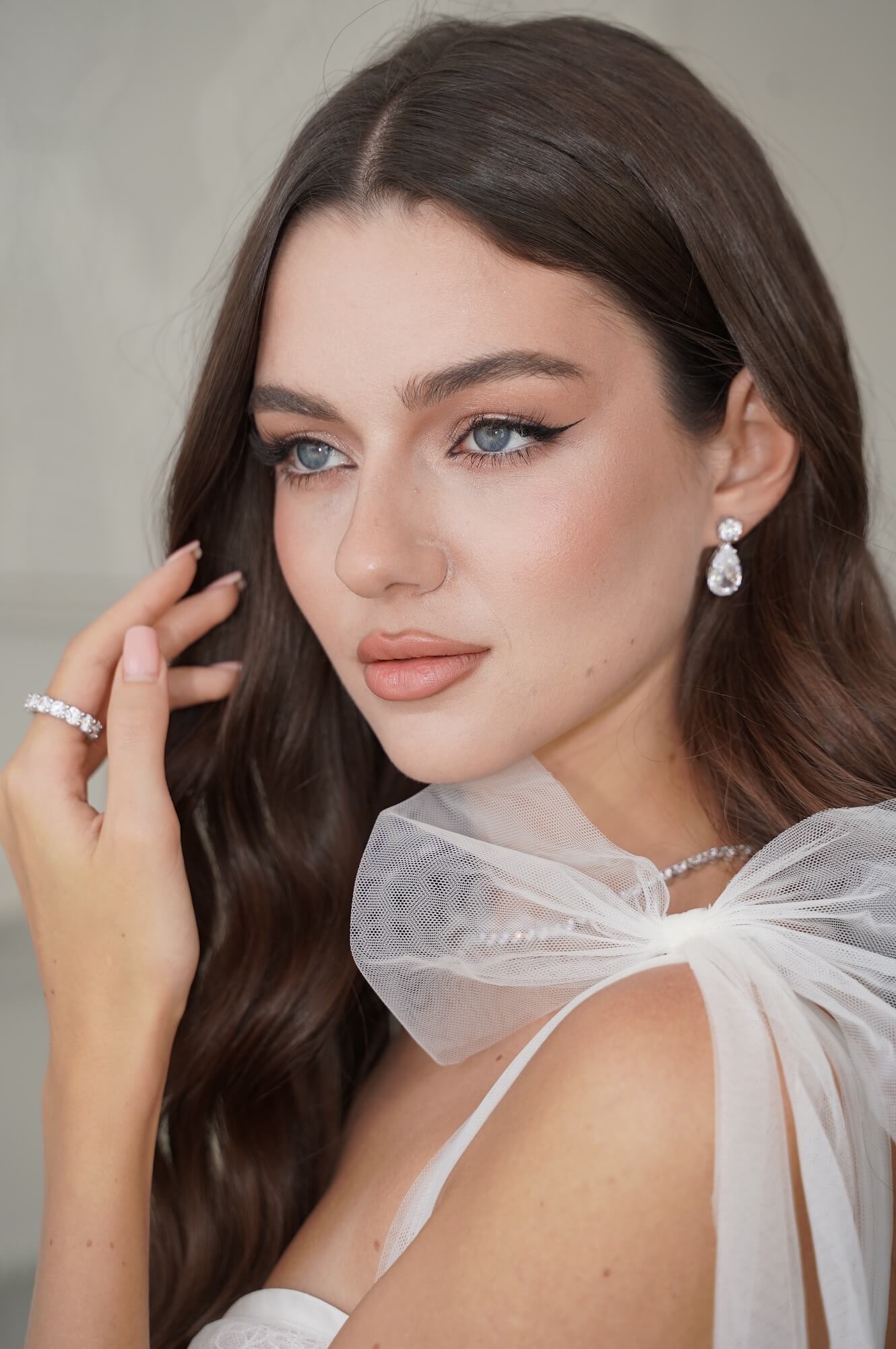 Model in bridal attire wearing an eternity band with pavé detailing