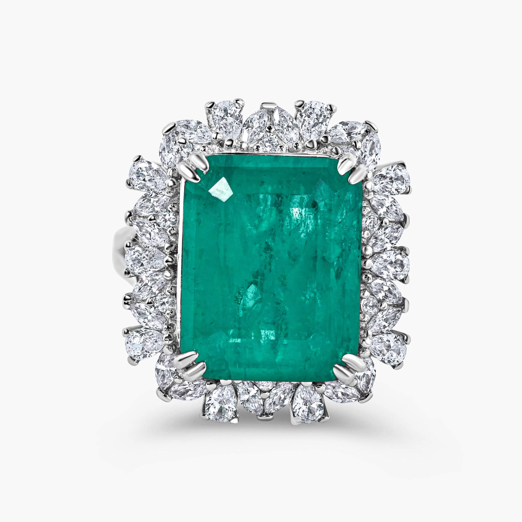 Green cocktail ring in sterling silver with an emerald-cut lab-created emerald alternative center stone and halo setting