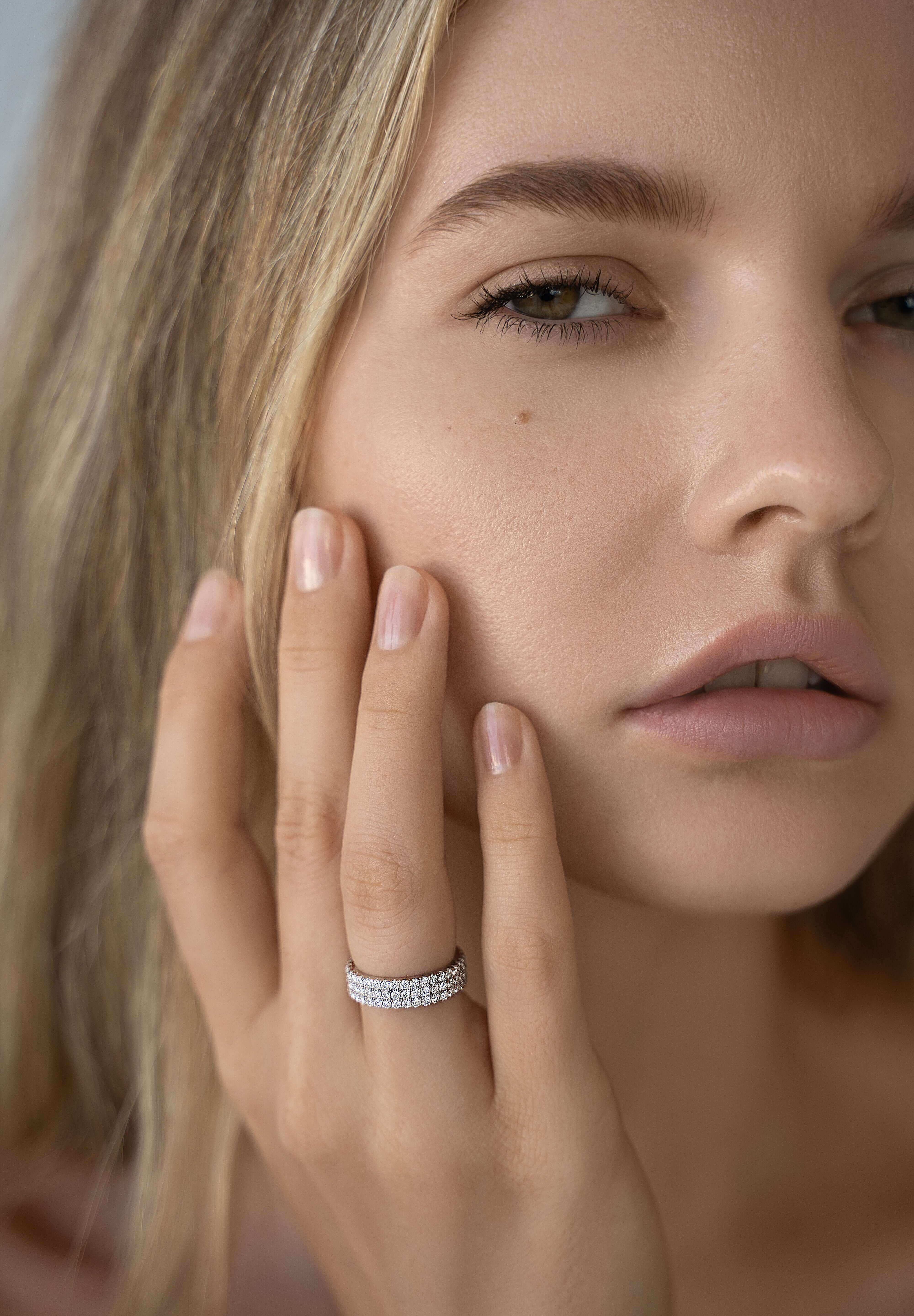 Sterling silver triple eternity ring styled on hand — The Abebi by VH.