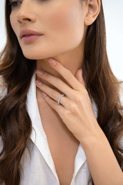 Sterling silver eternity band styled on hand — The Adara Ring by VH.