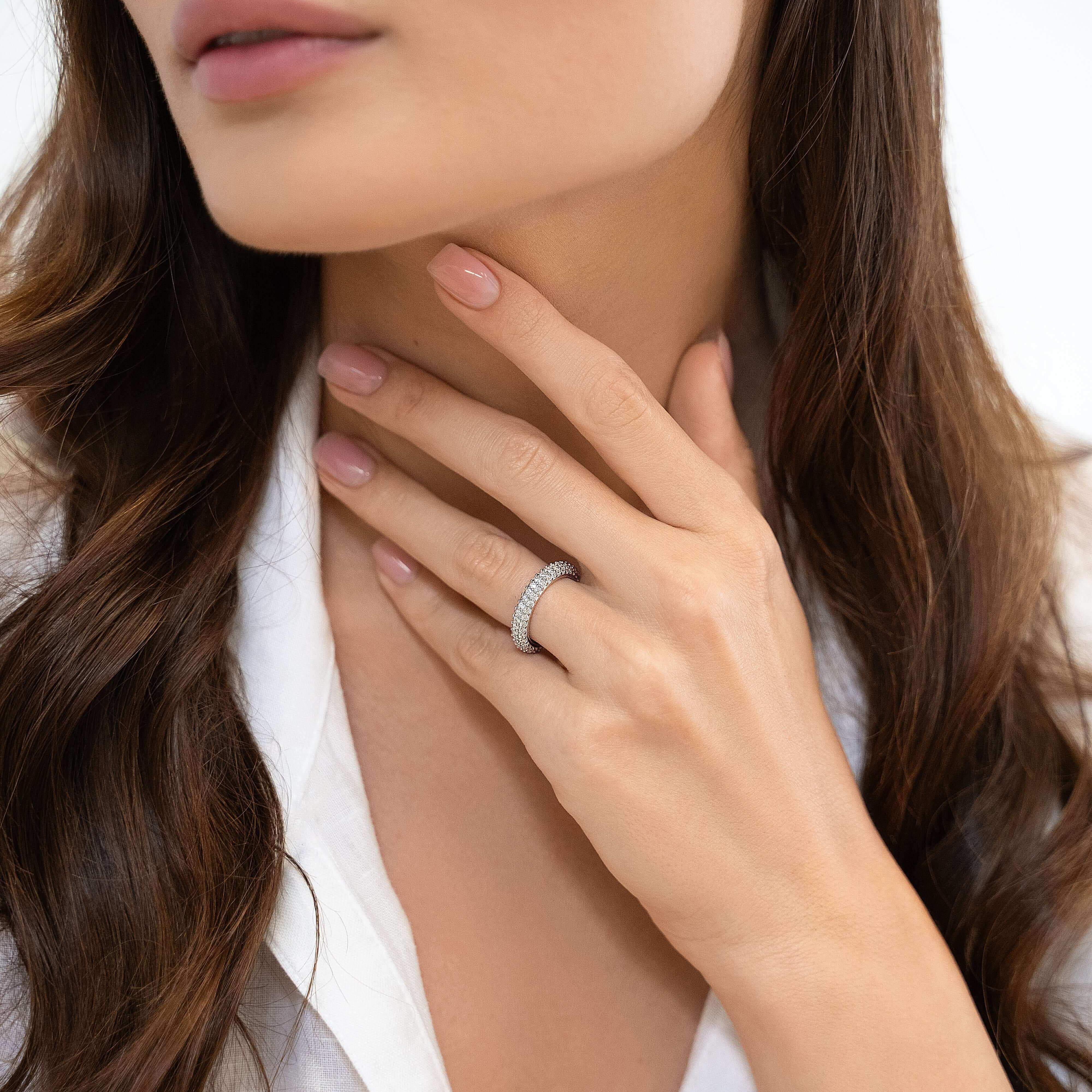 Sterling silver eternity band styled on hand — The Adara Ring by VH.