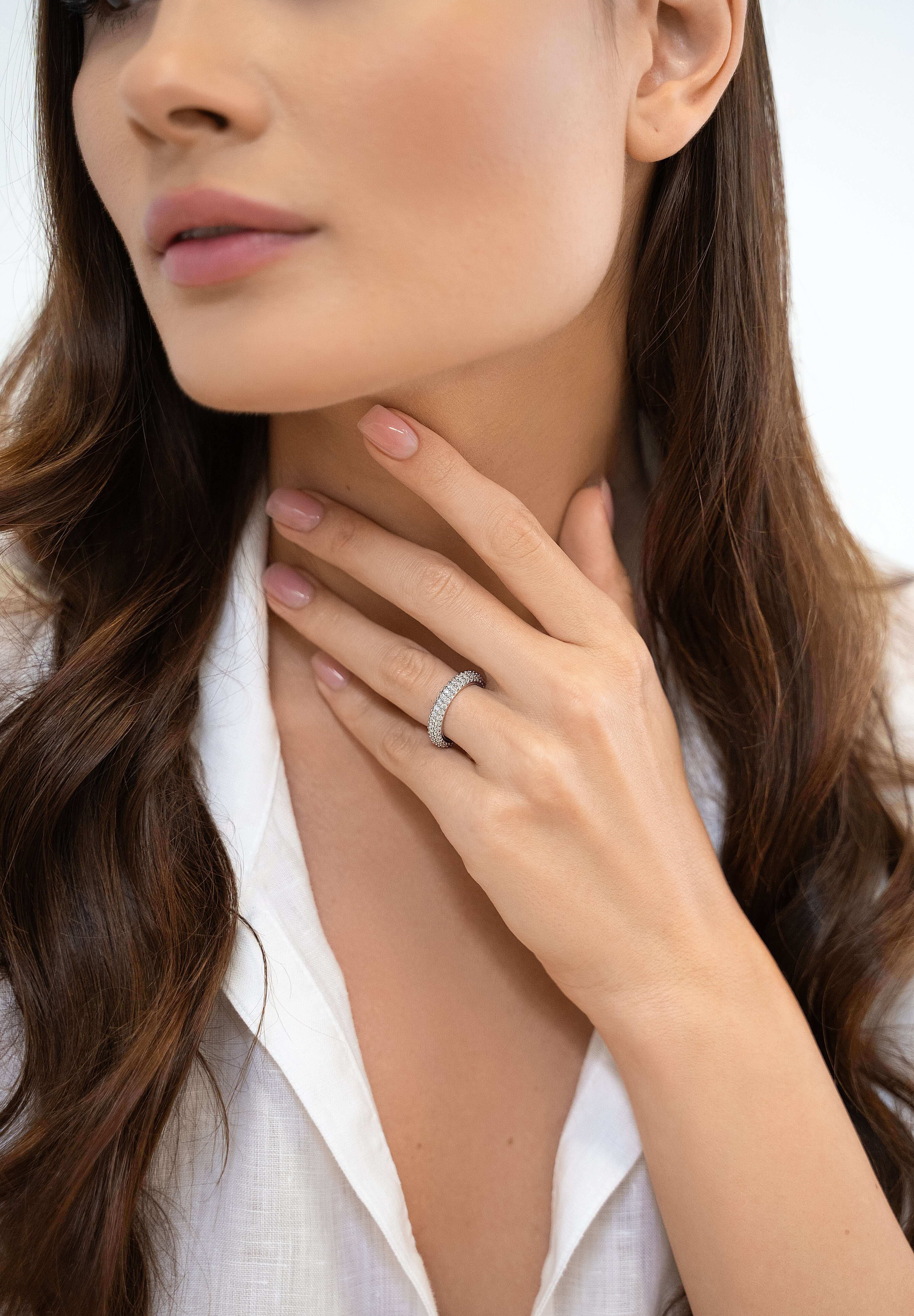 Sterling silver eternity band styled on hand — The Adara Ring by VH.