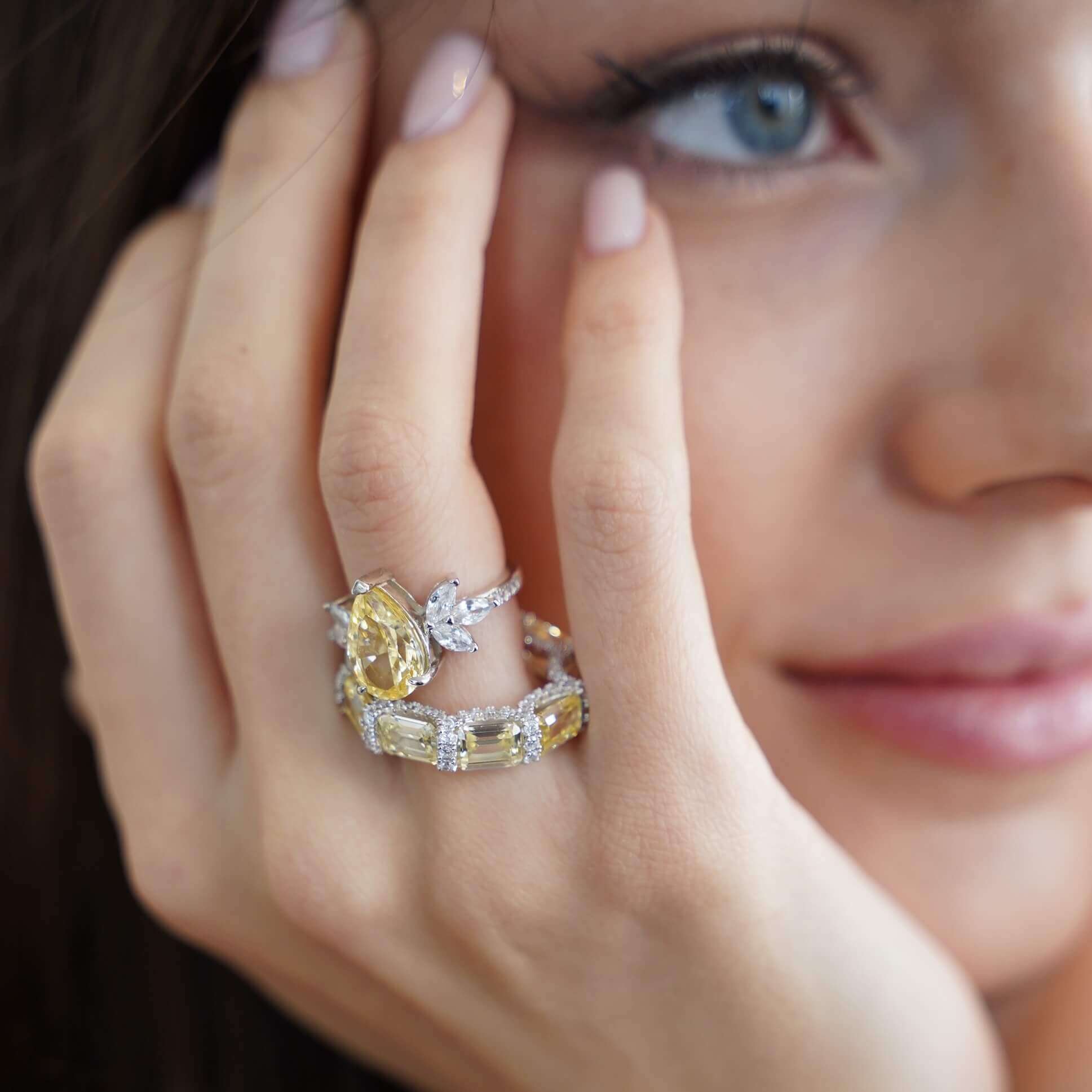 The Gia Ring by Viviana Halil – emerald-cut premium zirconia ring in a horizontal setting with pavé band on pure sterling silver.