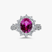 Close-up of The Lucia Ring showcasing rosa pink center stone and halo brilliance by Viviana Halil. 