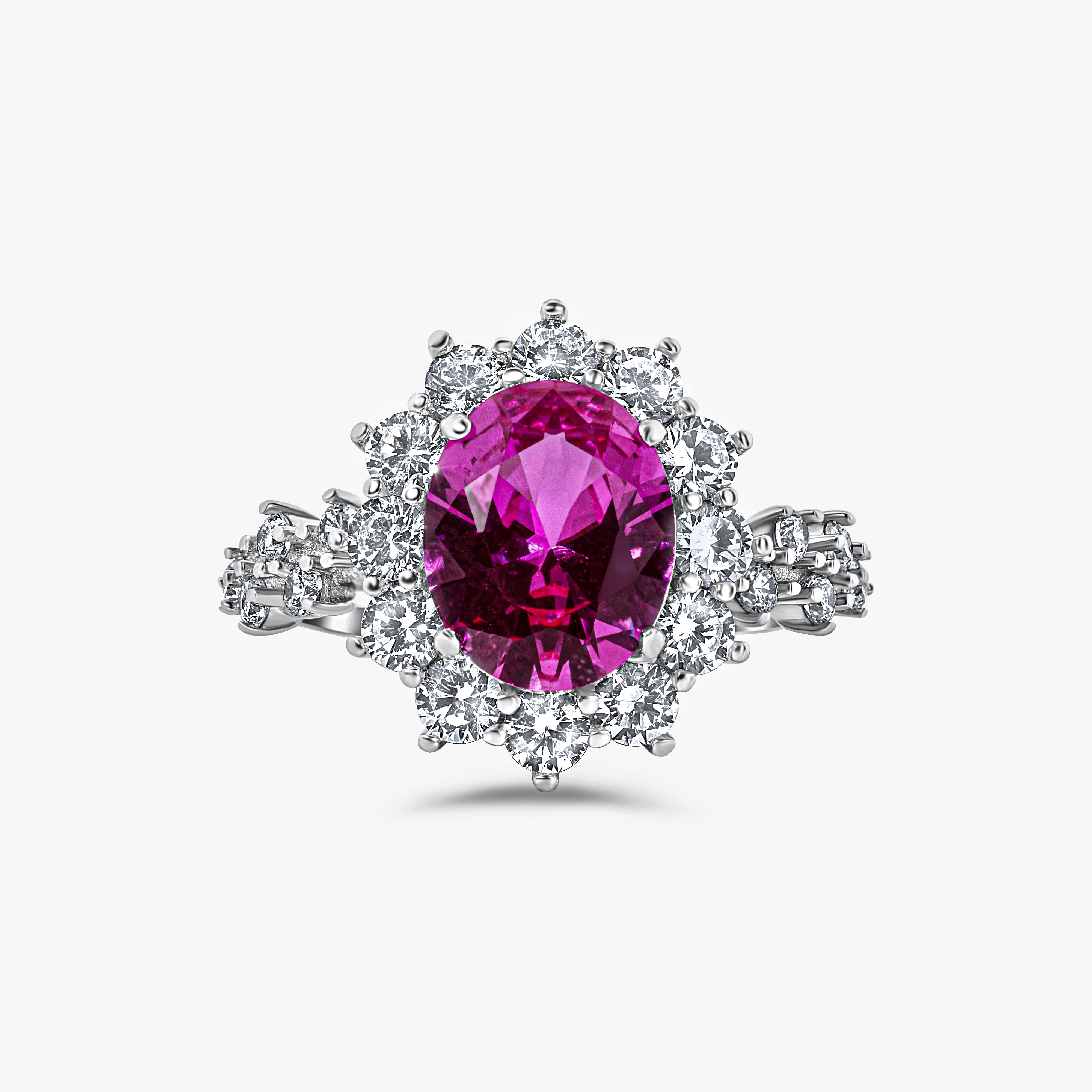 Close-up of The Lucia Ring showcasing rosa pink center stone and halo brilliance by Viviana Halil. 