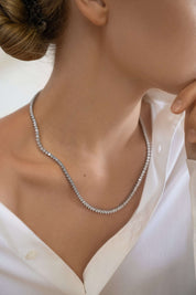 Editorial jewelry image of The Soleil Tennis Necklace — soft luxury for modern icons.