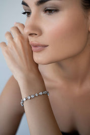 Sterling silver bracelet styled on wrist — The Variété de Lumières by Viviana Halil.