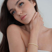 Petite Luxxe Tenné 2MM 18k gold tennis bracelet by viviana halil. 
