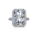 Emerald cut halo ring in sterling silver with a large rectangular centre stone and pavé halo by Viviana Halil.