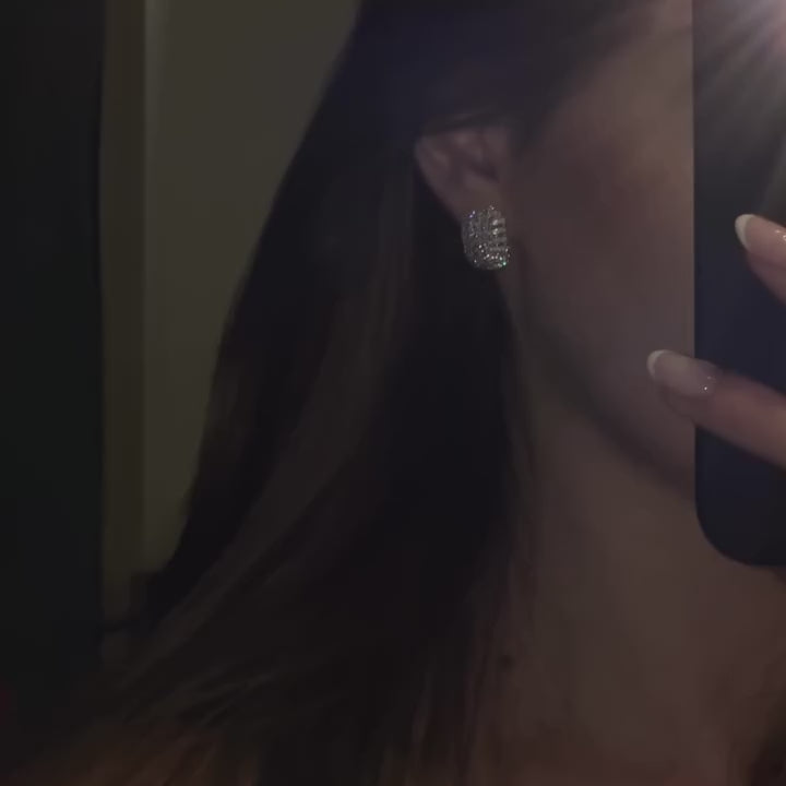 A video close-up of the Edith oval cluster stud earrings sterling silver set with flawless diamond alternatices