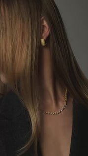 the audrey earrings in 18k gold by viviana halil model wearing in video
