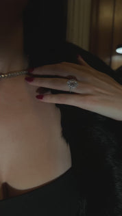 The Mon Cheri Ring by Viviana Halil worn by model in dark bar lounge aesthetics