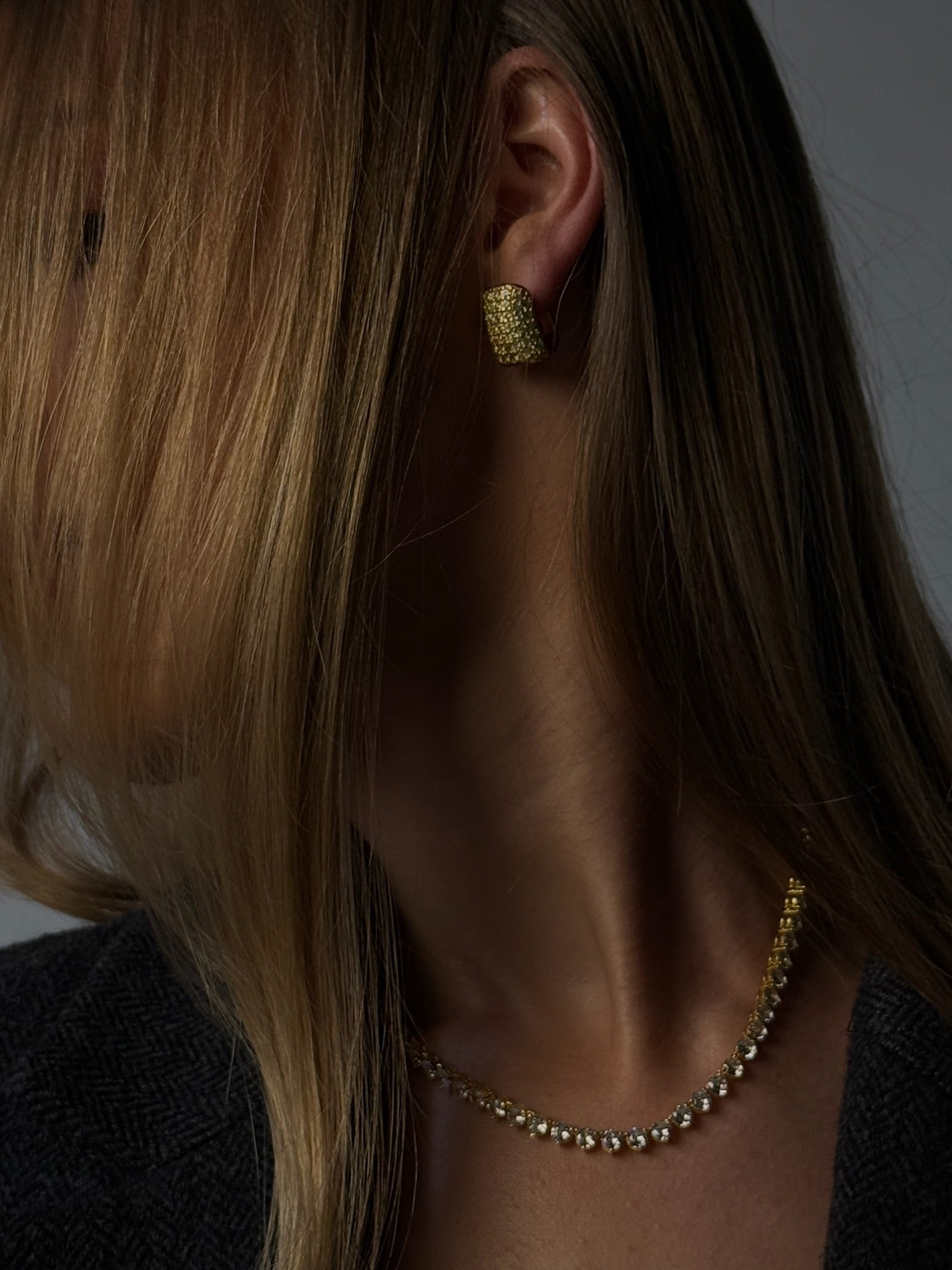 The audrey earring by Viviana Halil fine jewelry earrings in 18k gold-coated silver worn by model
