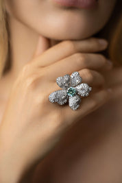 Editorial shot of model wearing The Flower Ring, a floral design crafted in sterling silver and moissanite. Only at VH of Beverly Hills. 