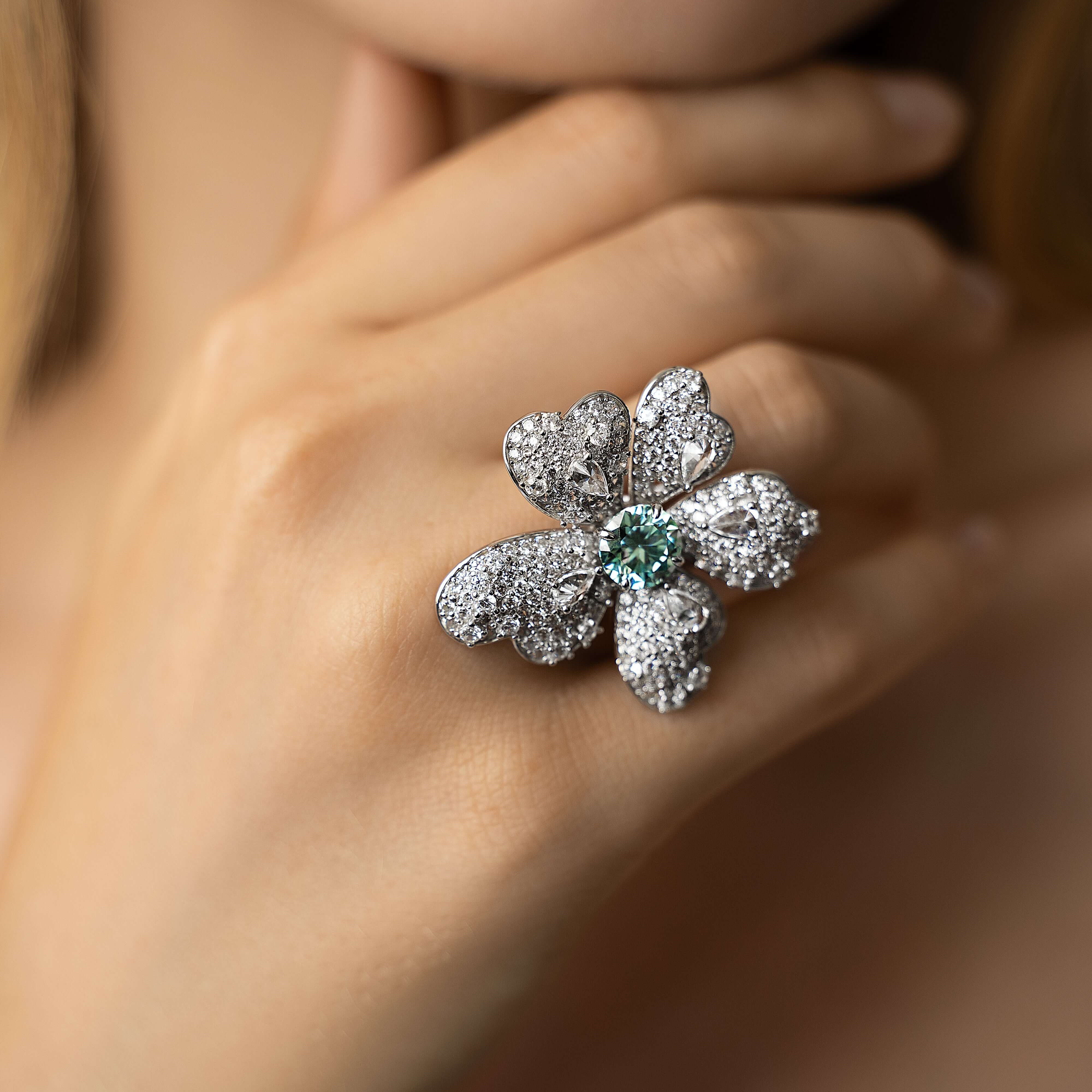 Editorial shot of model wearing The Flower Ring, a floral design crafted in sterling silver and moissanite. Only at VH of Beverly Hills. 