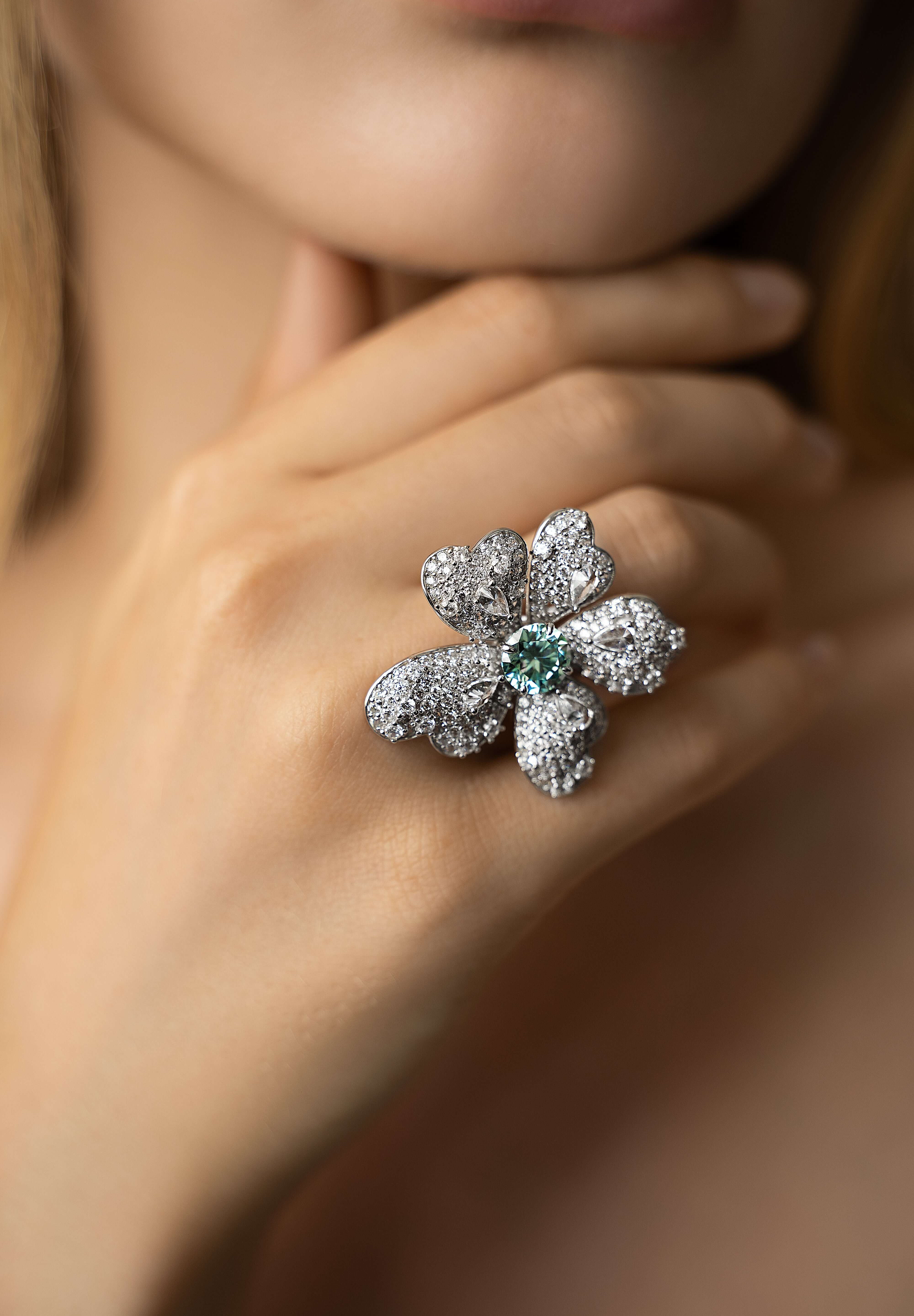 Editorial shot of model wearing The Flower Ring, a floral design crafted in sterling silver and moissanite. Only at VH of Beverly Hills. 