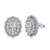 A pair of sterling silver earrings with a double halo setting featuring premium zirconia stones.