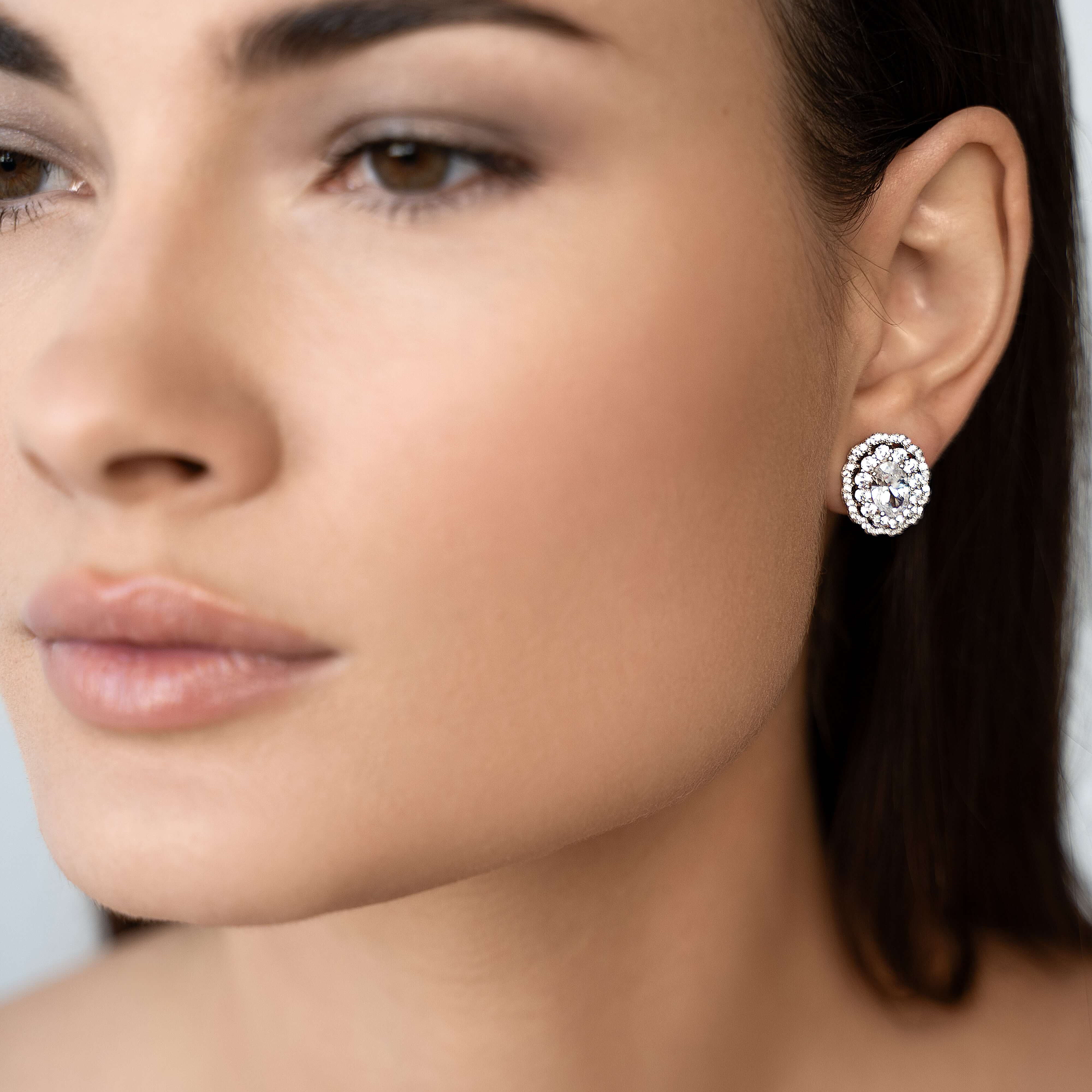 The Louis double halo stud earrings exude a vintage-inspired design, set in sterling silver and premium diamond simulants by VH.