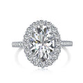 Oval ring with halo in sterling silver featuring a pavé setting and precision-cut center stone