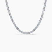 A sterling silver necklace featuring a row of Moissanite stones set on a 4-prong setting.
