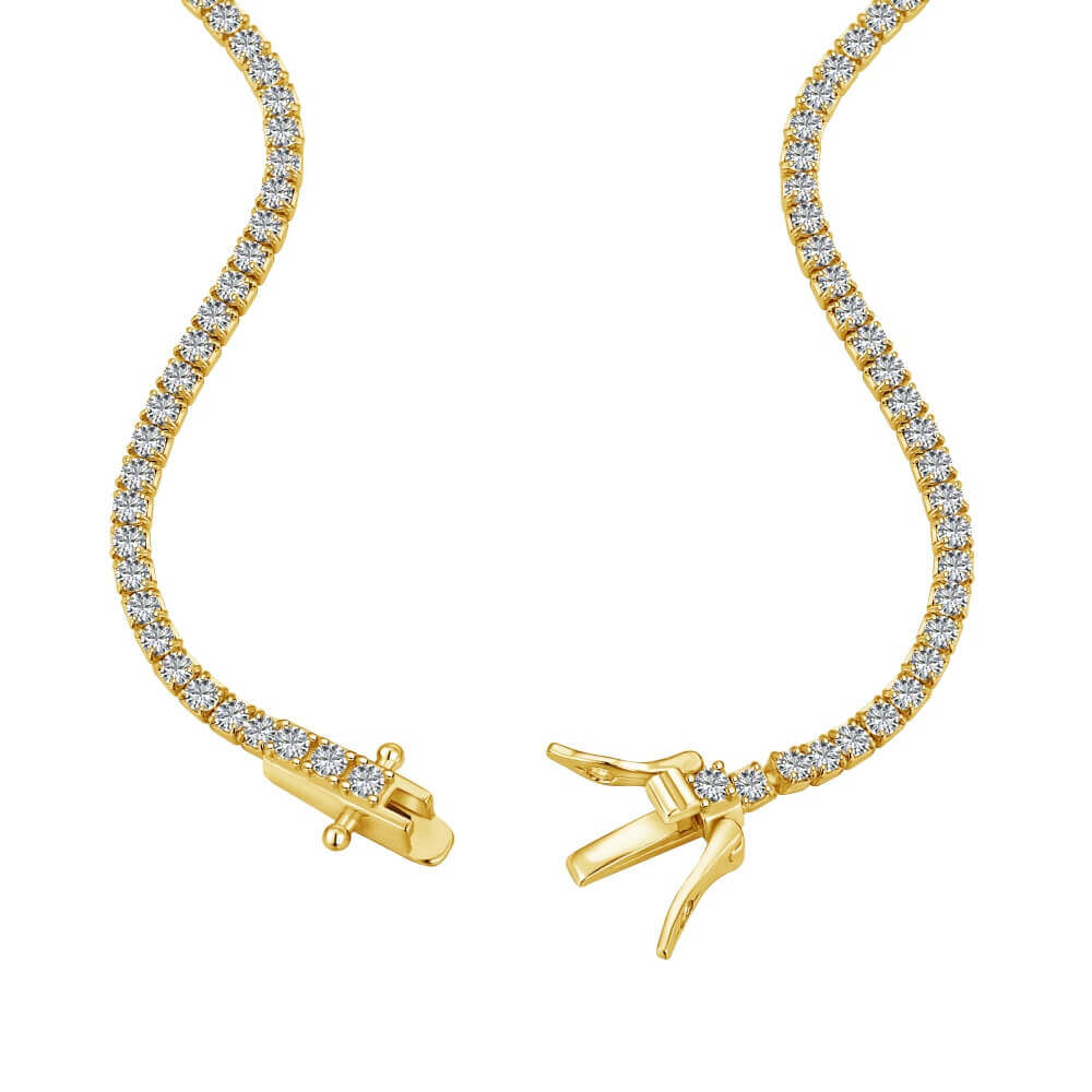 The petite luxxe tenne 18k gold tennis necklace featuring a box clasp and row of premium diamond simulants a design by Viviana Halil. 
