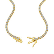 The petite luxxe tenne 18k gold tennis necklace featuring a box clasp and row of premium diamond simulants a design by Viviana Halil. 
