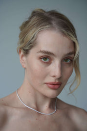the petite luxxe tenne sterling silver tennis necklace featuring a row of premium grade cubic zirconia design by Viviana Halil. 